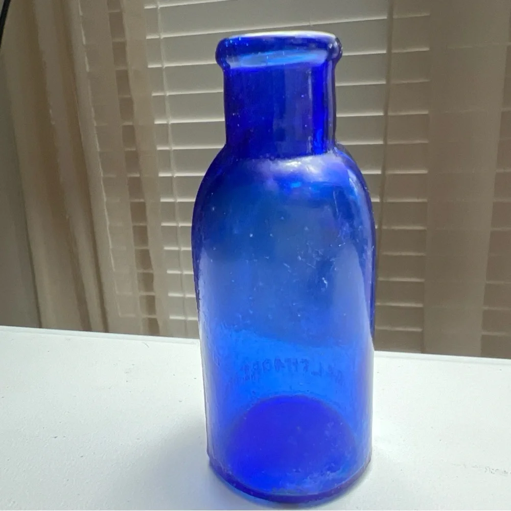 Lot of 4 vintage Colbalt Blue Glass Bottles